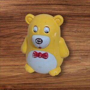 Vintage Yellow Bear Roly-Poly Musical Toy With Red Bow Tie retro